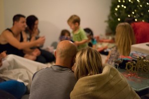 Unwrapping gifts under the Christmas tree.